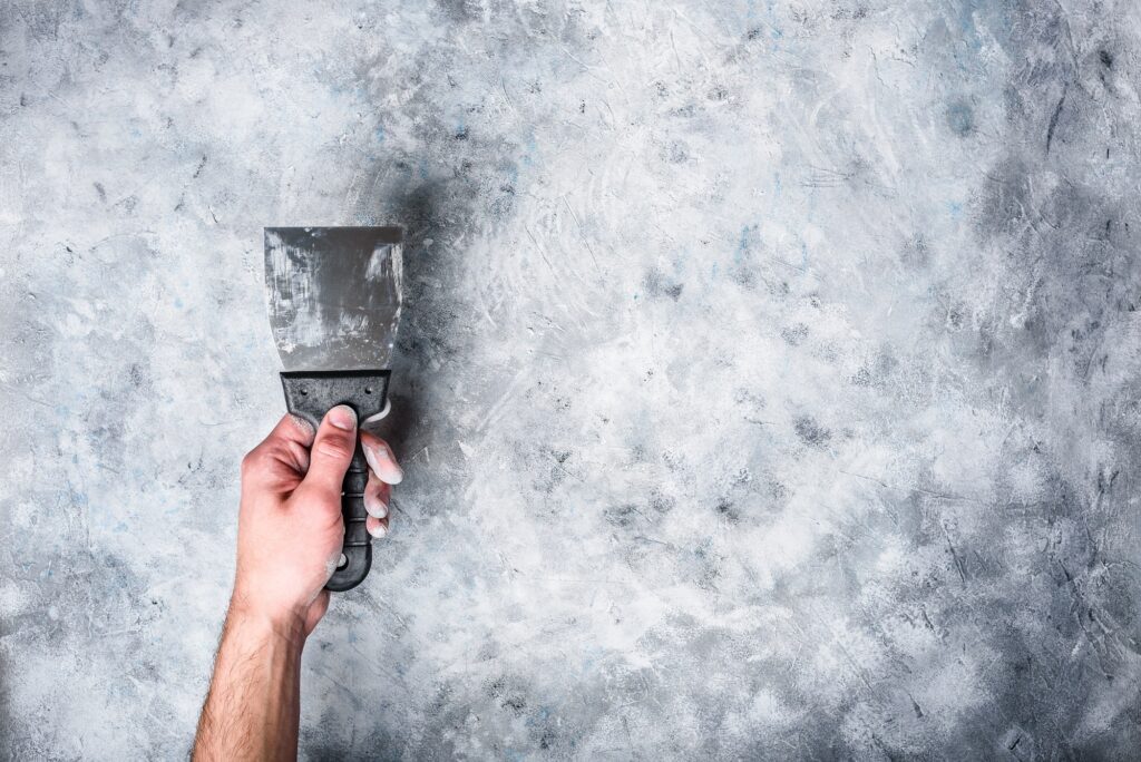 Hand Holds Dirty Spatula